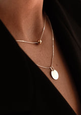 NO MORE accessories Bubble Necklace in sterling silver with gold plated pendant